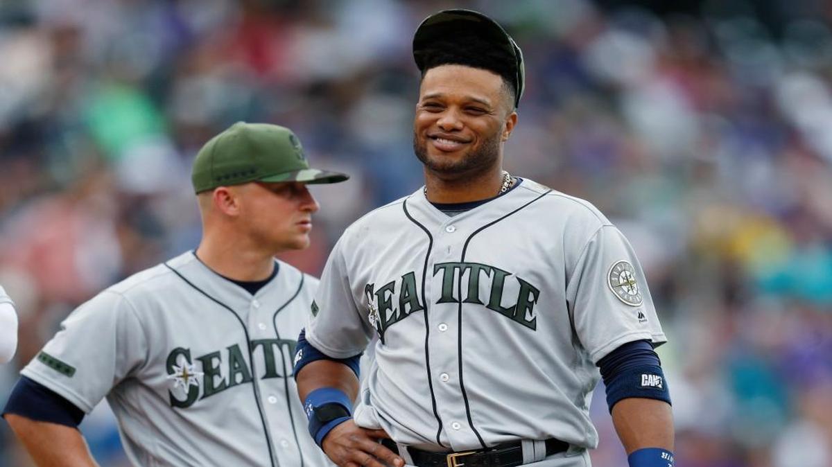 Seattle Mariners second baseman Robinson Cano waits with third baseman Kyle Seager for relief pitcher Tony Zach to take the mound to face Colorado Rockies pinch-hitter Pat Valaika in the seventh inning of an interleague baseball game Monday, May 29, 2017, in Denver.