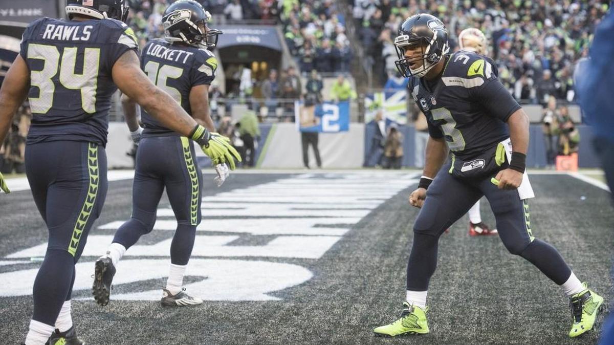 Seahawks quarterback Russell Wilson, right, and running back Thomas Rawls could be celebrating a lot more together if Seattle would go for two more often.