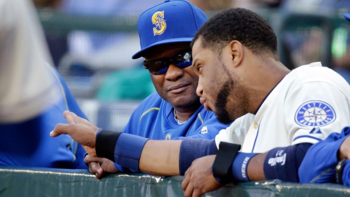 
Mariners manager Lloyd McClendon, left, talks with Robinson Cano Sunday at Safeco Field. McClendon said a 2-9 homestand early in the season was when the team got mired in a rut. 
