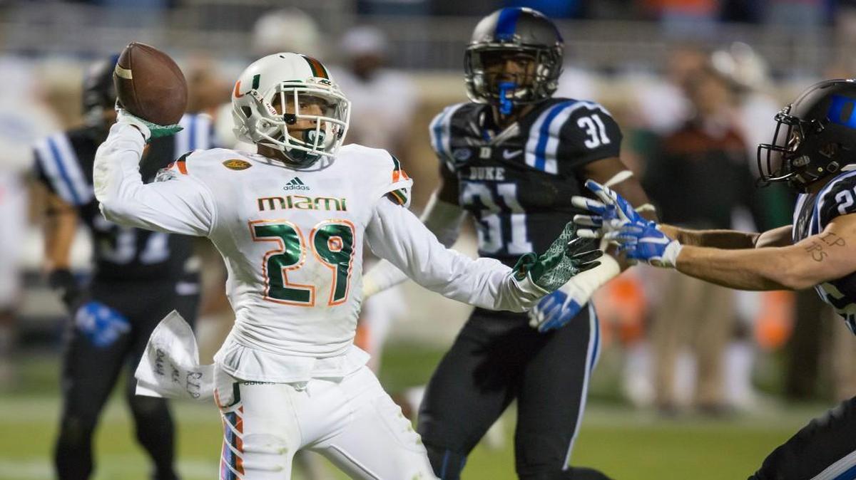 Miami’s Corn Elder (29) throws a lateral during a kickoff return which featured multiple laterals before Elder subsequently received the final lateral and scored to beat Duke 30-27 on Saturday. The officiating crew was suspended two games for missing several calls on the play.
