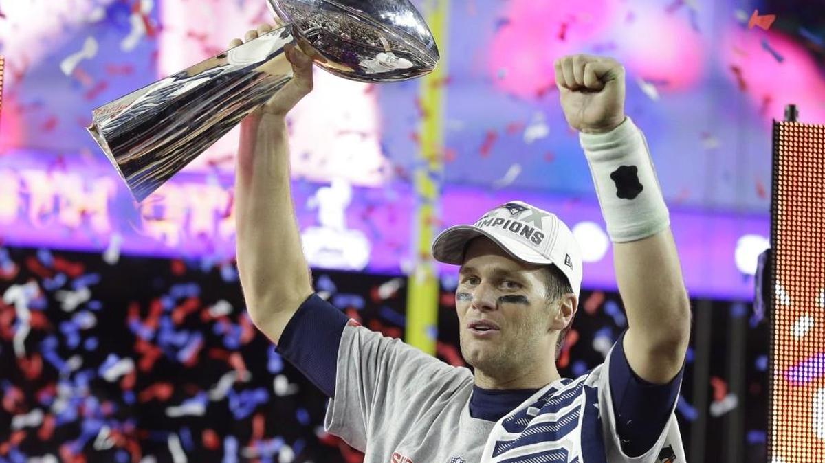 Patriots quarterback Tom Brady celebrates with the Vince Lombardi Trophy after New England won NFL Super Bowl XLIX. Boston professional sports teams have one 36 championships compared to Atlanta’s one.
