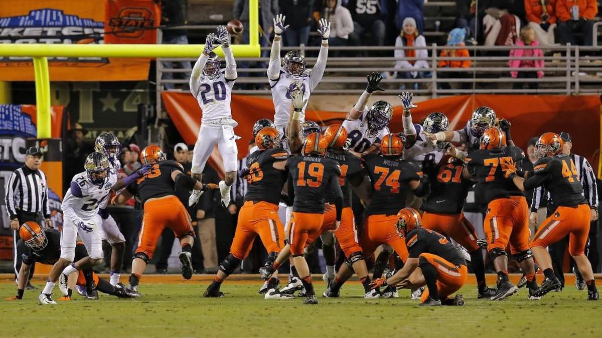 Oklahoma State place kicker Ben Grogan attempts a field goal during the Cactus Bowl against Washington, Friday, Jan. 2, 2015, in Tempe, Ariz. Oklahoma State won 30-22.