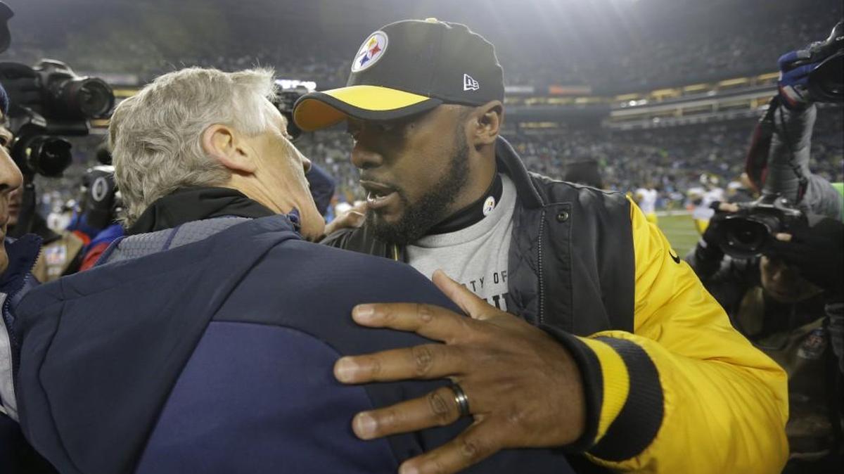 Seahawks head coach Pete Carroll, left, greets Steelers head coach Mike Tomlin, right, after Seattle defeated Pittsburgh, 39-30, at CenturyLink Field on Nov. 29.