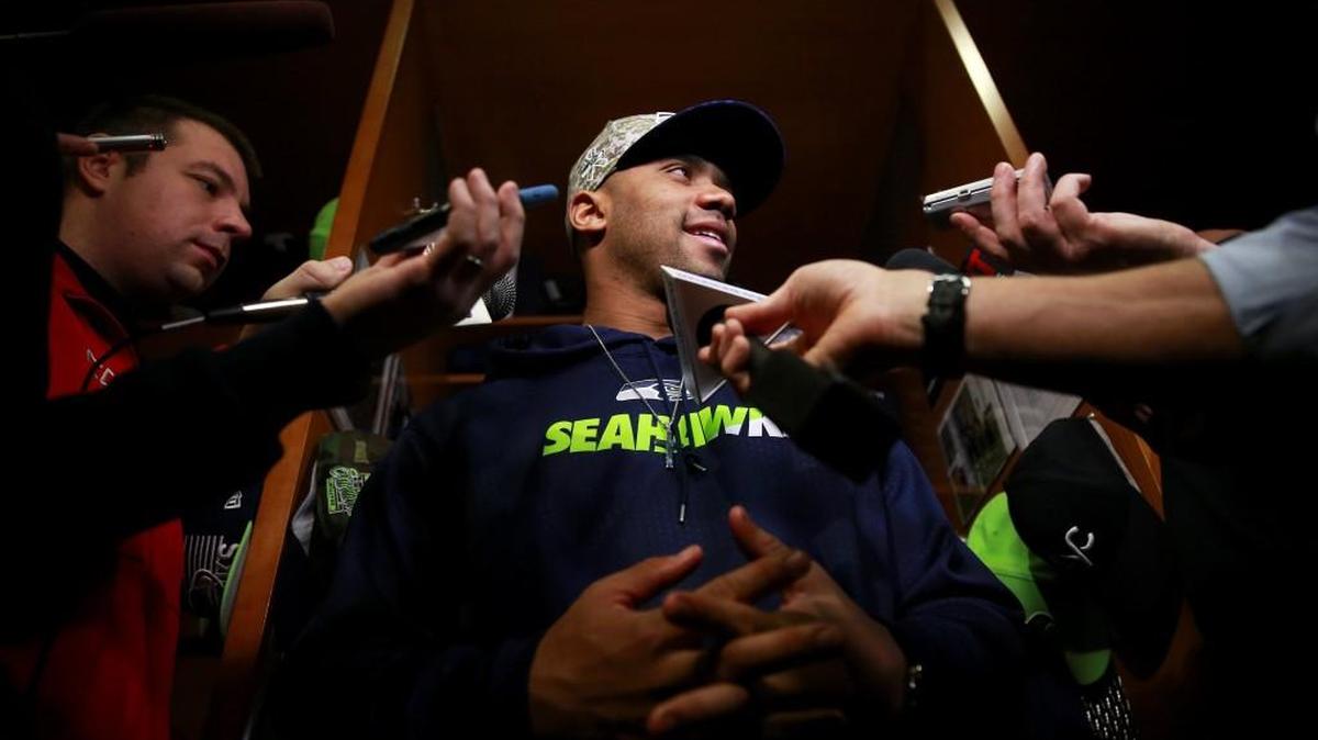 Seattle Seahawks quarterback Russell Wilson talks to the media in the team locker room, Monday, Jan. 18, 2016, in Renton. The Seahawks' season ended Sunday, Jan. 17, 2016, with a loss to the Carolina Panthers.