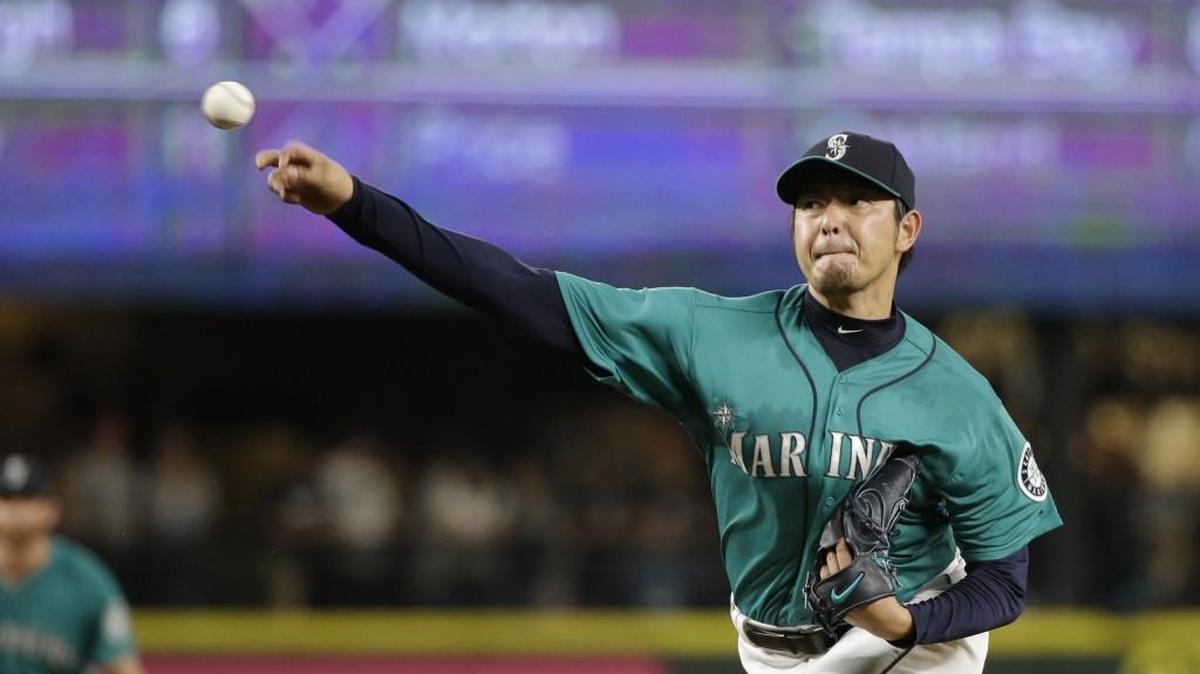 Seattle Mariners starting pitcher Hisashi Iwakuma throws against the Colorado Rockies on Sept. 11. Iwakuma, a free agent, signed with the Dodgers on Monday.