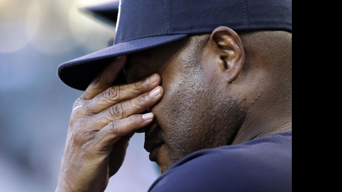 
Seattle Mariners manager Lloyd McClendon rubs his eyes after a run by Kansas City during a June 24 game in Seattle. The Mariners have stumbled through the season’s first half, struggling in every facet of the game. 
