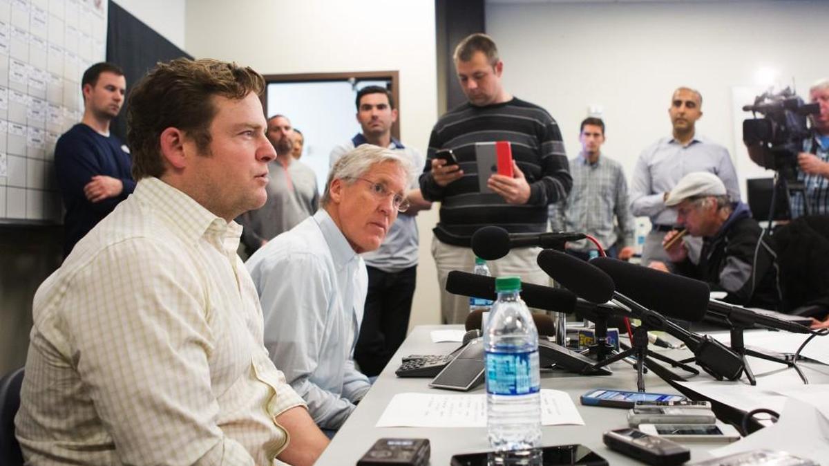 Seattle Seahawks coach Pete Carroll and general manager John Schneider, front, speak with reporters Saturday. The Seahawks made 10 draft picks over the 7 rounds, concluding with running back Zac Brooks as the 247th pick.