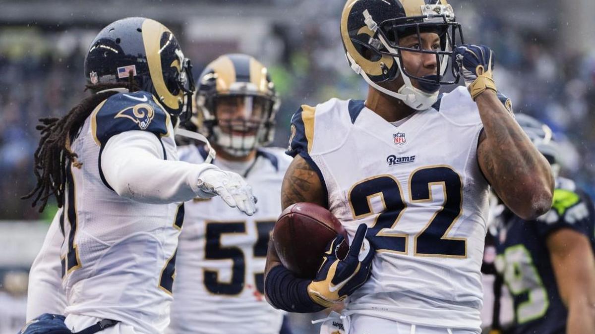 Rams cornerback Trumaine Johnson celebrates after intercepting a pass from Russell Wilson in the second quarter of St. Louis’ 23-17 win over the Seahawks in Seattle on Sunday.
