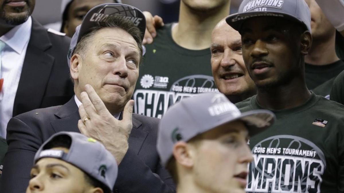Michigan State head coach Tom Izzo celebrates with his players after beating Purdue in the finals at the Big Ten Conference tournament on Sunday. Columnist John McGrath picks the Spartans to celebrate again April 4 in Houston.