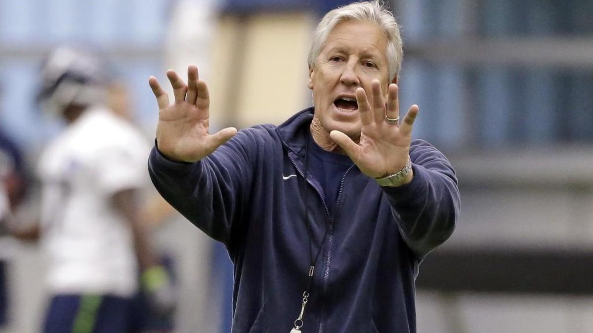 Seattle Seahawks coach Pete Carroll motions to players during an NFL football practice Thursday, June 15, 2017, in Renton.