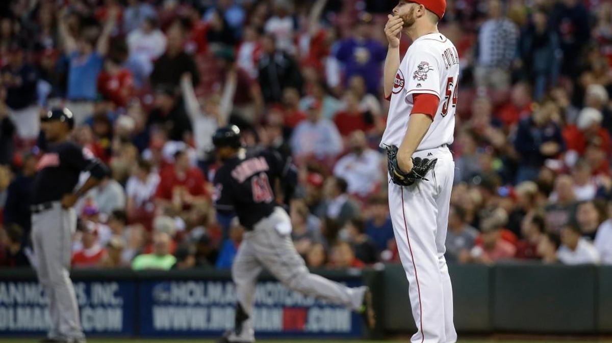 Cincinnati pitcher Caleb Cotham (54) reacts after giving up a two-run home run to Cleveland’s Carlos Santana, center rear, during the fifth inning Thursday. The Reds bullpen is ranked No. 30, among 30 teams, in virtually every pitching category.