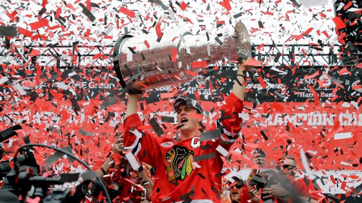 
Chicago Blackhawks captain Jonathan Toews holds up the Stanley Cup during a rally at Soldier Field in Chicago in June. 
