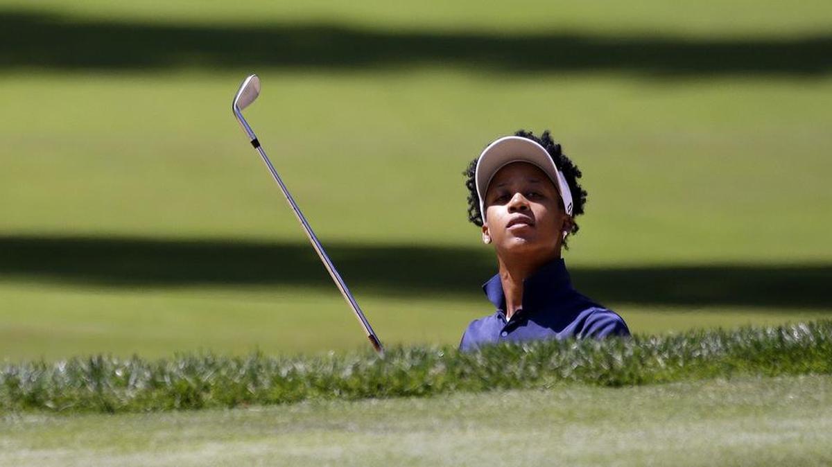 Bethel High School graduate Sadena Parks seeks to escape a bunker at Sahalee on Friday. For Parks, the Women’s PGA was her first major in her home state.